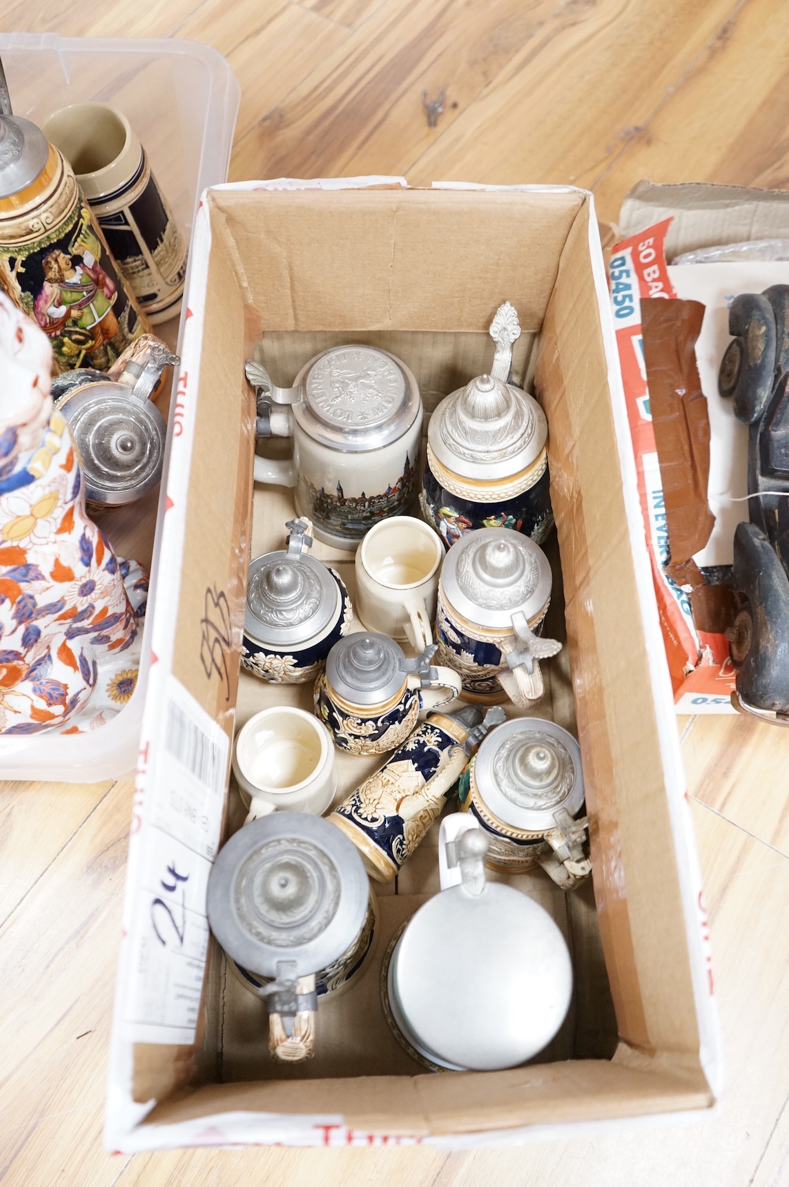 A collection of German ale steins and an Imari seated cat-37cm high